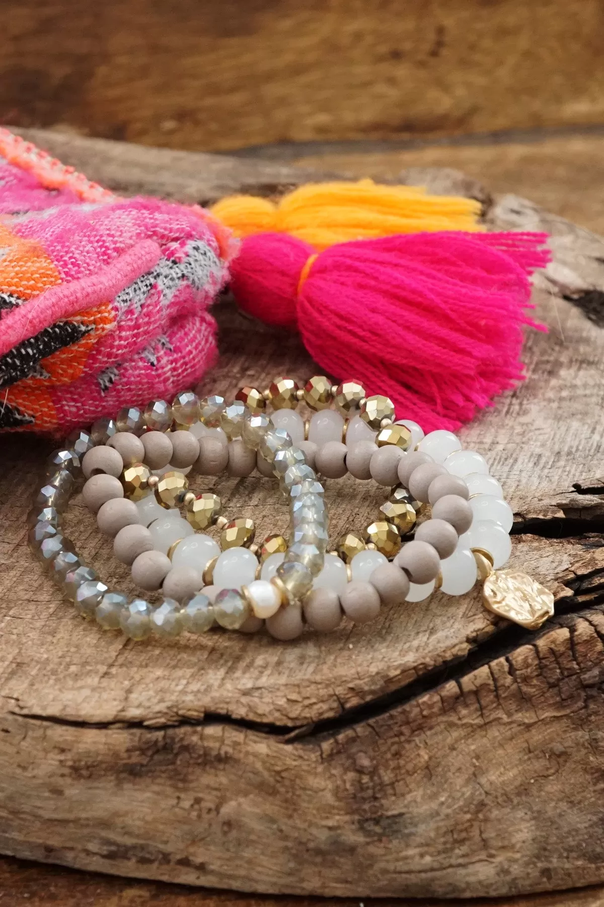 Beaded Bracelets set in White and Gray with a coin charm