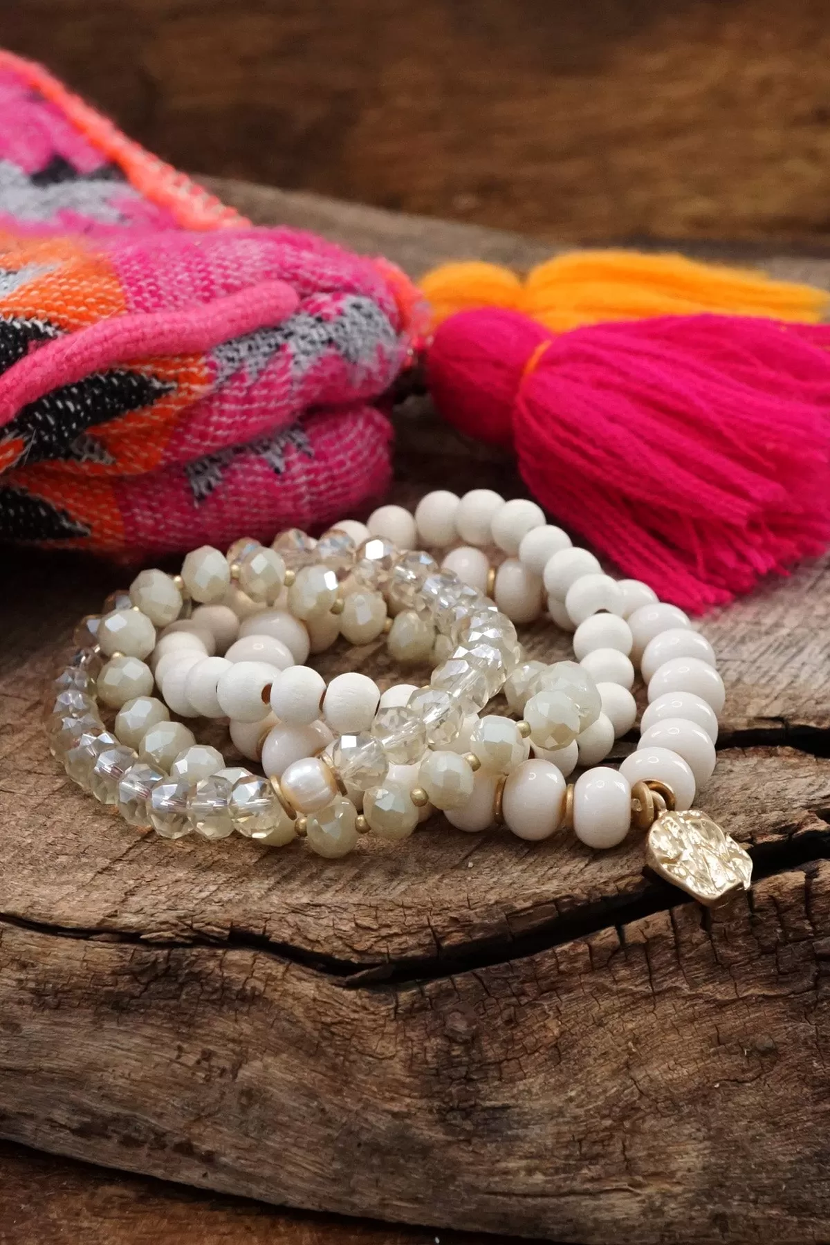 Beaded Bracelets set in White with a coin charm